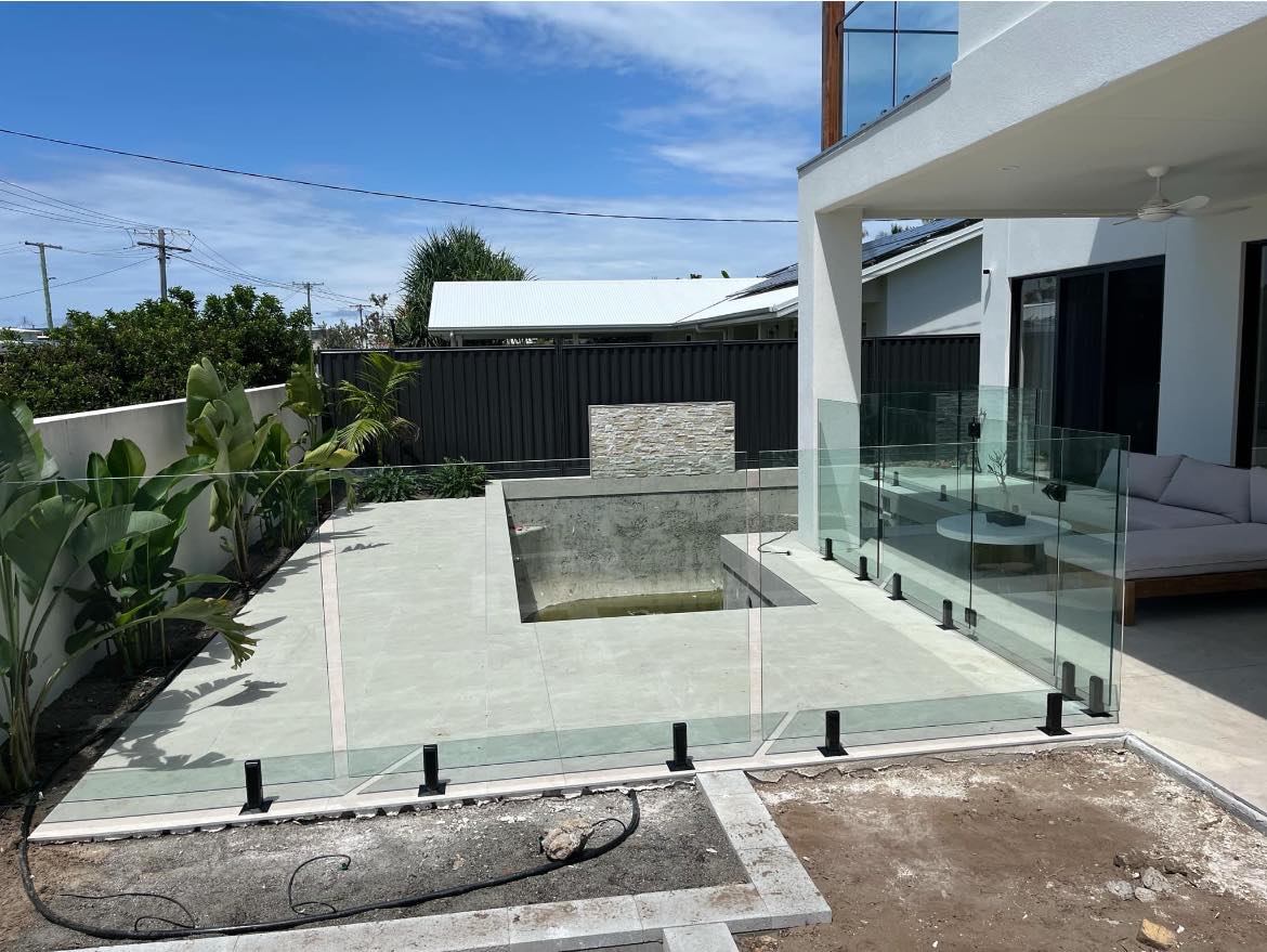 Frameless glass pool fence with clear panels